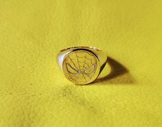 Handmade Gold Spiderman ring  Personalized gift for best person in your life. Oval Signet ring  1👉Meterial -- 925 Sterling solid Silver Silver/Gold/Rose gold Finished Available. Free and Fast Delivery Free Engraving. All Sizes 2 To 13 US Available. Any type of Personlization and customisation options available. Please do not hesitate to contact us if you require any further information or have any problems.  Any issues we will ensure that they are resolved with 100% customer satisfaction. https://www.etsy.com/shop/Zamzamsilver Thank you for visiting My Store. ❤️ Zam Zam Silver ❤ Handmade Red Signet Ring For Anniversary, Rings Spiderman, Spiderman Ring, Gold Spiderman, Red Rectangular Signet Ring For Gift, Father's Day Gift: Polished Signet Ring, Sterling Silver Star-shaped Signet Ring For Gift, Kids Ring, Spiderman Kids