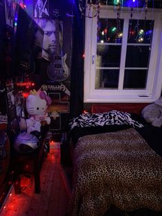 a bedroom decorated in black and white with lights on the ceiling, leopard print comforter, and bedding