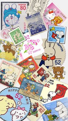 many different stamps are arranged together on the table, including one with an image of cartoon characters