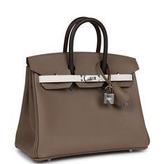 This tricolor Birkin 25 is in Etoupe, Ebene and Gris Pale epsom leather with palladium hardware and has tonal stitching, front flap, two straps with center toggle closure, clochette with lock and two keys, and double rolled handles.The interior is lined with Etoupe chevre and has one zip pocket with an Hermes engraved zipper pull and an open pocket on the opposite side.Collection: BOrigin: FranceCondition: New and never worn (plastic on hardware)Accompanied by: Hermes box, Hermes dustbag, clochette, lock, two keys, clochette dustbag, carebook and ribbon Measurements: 10" width x 7.5" height x 4.75" depth; 2.75" handle drop Hermes Birkin 25, Hermes Box, Luxury Purses, Birkin 25, Luxury Bag, Backpack Tote Bag, Diaper Backpack, Outfits Casual, Clothing Ideas