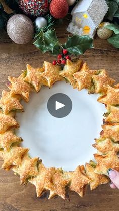 someone is making a christmas wreath out of puff pastry