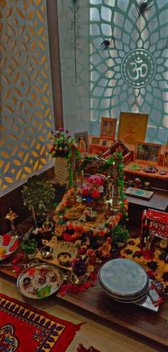 an elaborately decorated table with plates and bowls