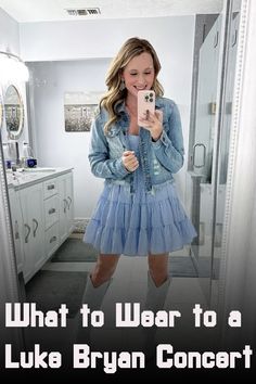 a woman taking a selfie in a bathroom mirror with the caption what to wear to a luke ryan concert