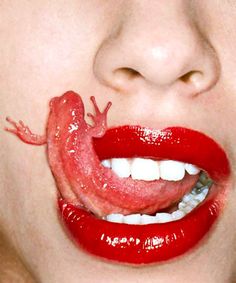 a woman with red lipstick and a gecko on her lip, saying mutantss are you sure this is evolution?