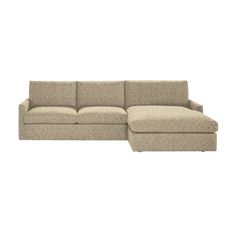 a beige sectional couch sitting on top of a white floor