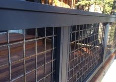 a close up of a metal fence with bars on it