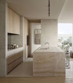 a modern kitchen and dining room with wood flooring