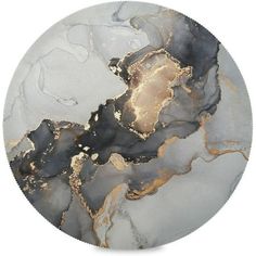 a white and black marble plate with gold foiling on the edges, sitting in front of a white background