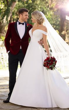 the bride and groom are standing together outside