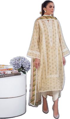 Elegant Semi-stitched Lawn Suit With Printed Motifs, Elegant Jamawar Salwar Kameez With Embroidered Border, Designer Silk Lawn Suit With Embroidered Border, Anarkali Lawn Suit With Lace Work In Organza, Beige Jamawar Dupatta With Intricate Embroidery, Anarkali Style Cream Lawn Suit With Dupatta, Cream Anarkali Lawn Suit With Dupatta, Cream Dupatta With Lace Work For Festive Occasions, Elegant Mulmul Salwar Kameez With Embroidered Border