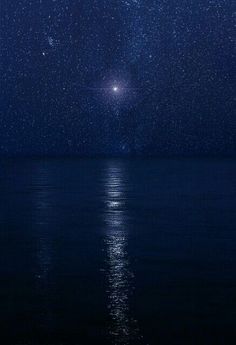 the night sky is filled with stars and water