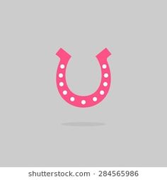 a pink horseshoe shaped light up sign on a gray background with room for your text