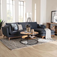 a living room filled with furniture on top of a hard wood floor