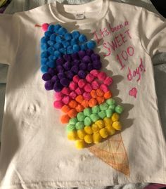 a t - shirt that says it's been a sweet ice cream cone with pom poms