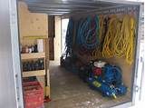 the inside of a storage area with various hoses and other items in it,