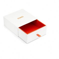 a white box with an orange lining and the lid opened to show the inside of it