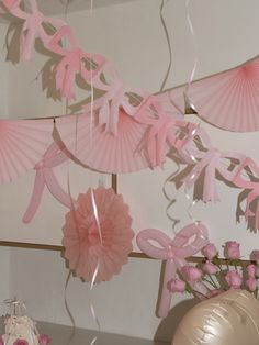 some pink decorations are hanging from the ceiling