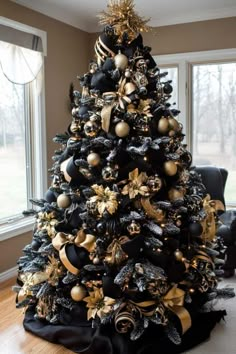 a black and gold christmas tree in a living room