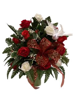 a bouquet of red and white flowers in a glass vase with ribbon on the side