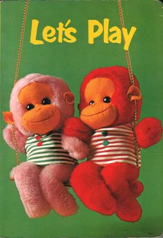 an old children's book with two stuffed monkeys hanging from the front and back