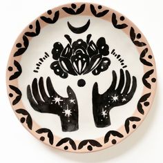 a plate with black and white designs on it