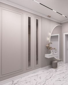 a white bathroom with marble floors and walls