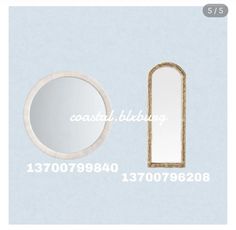 a white mirror and a gold framed mirror on a light blue background with the words coastal bedding above it