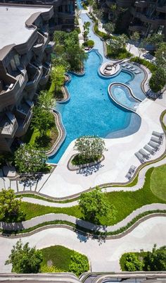 an aerial view of a swimming pool surrounded by buildings