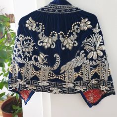 Statement gorgeous hand embroidered velvet cape or an apron to wear with a skirt or trousers, vintage Romanian festive clothing. Amazing hand embroidery silver yarns and sequins and delicate pearls on a royal blue silk velvet, very elegant, glamourous. It has a cotton linen on the back where is the embroidery. The velvet seems to be silk velvet, very delicate and soft. Part of a festive folk costume from the second half of the 20th century, it is a statement timeless item. In good conditions, on Festive Sequin Shawl, Embroidered Velvet Shawl For Wedding, Traditional Blue Embellished Embroidered Fabric, Traditional Embroidered Shawl For Party, Bohemian Embellished Embroidered Fabric For Party, Bohemian Embroidered Embellished Fabric For Party, Bohemian Embellished Embroidered Fabric For Festive Season, Traditional Shawl With Drape For Party, Traditional Shawl With Traditional Drape For Parties