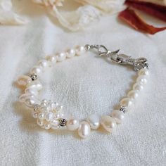 Material:  Baroque Pearls(White);                   Freshwater Pearls(White). Length:   20 cm(8 inches). Hi,Dear Customers!We are dedicated to choose high-quality freshwater pearls and natural crystal/gemstone to make jewelry. All of them are selected elaborately and carefully crafted. They are all handmade and each piece takes several hours even days to complete.We hope you can get a wonderful experience and enjoyment by choosing our products.(USPS Shipping with insurance included). Delicate Handmade Pearl Bracelets, Handmade Delicate Pearl Bracelets, Handmade Dainty Pearl White Bracelets, Handmade Delicate Pearl Bracelet, Delicate White Adjustable Crystal Bracelet, Delicate White Crystal Bracelet Gift, Handmade Pearl Crystal Bracelet, White Bohemian Bracelet With Pearl Charm, Bohemian White Bracelets With Pearl Charm