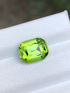 Delight in the refreshing hues of apple green peridot, a gemstone that exudes natural elegance and charm. Elevate your style with its captivating allure. Weight: 2.8cts Dimensions: 9.3x7.3x5.2mm.  .  . A Elegant Green Peridot Gemstones, Emerald Cut Green Gemstones With Accent Stones, Formal Peridot Gemstones For May Birthstone, Formal Lime Green Peridot Jewelry, Faceted Oval Green Gemstones, Green Peridot Gemstones For Gifts, Formal Green Faceted Gemstones, Faceted Green Gemstones For Formal Occasions, Formal Faceted Green Gemstones