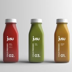 three bottles of juice with different flavors