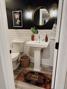 Come read all about why I love our basement bathroom painted black! It's a small space and black paint adds drama! Black Accent Wall Bathroom Half Baths, White And Charcoal Bathroom, Black Paint In Bathroom, Charcoal Bathroom Walls, Black And White Half Bathroom, Black Half Bathroom, Basement Upgrades, Small Basement Bathroom, Small Half Bathroom