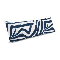 a blue and white zebra print pillow on a white background