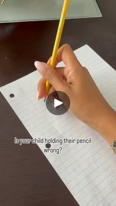 a person writing on a piece of paper with a pencil in their hand and the words is your child holding their pencil wrong?