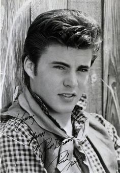 an old photo of a young man wearing a shirt and tie