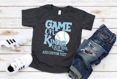 a t - shirt with the words game on and an image of a baseball