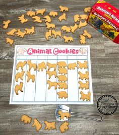 a bunch of cookies that are next to a box of dog biscuits on a table