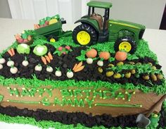 a tractor birthday cake with green frosting and decorations