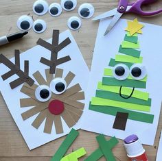 paper cut out to look like a christmas tree with eyes, nose and mouth on the table