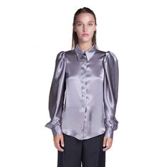 A classic shirt handcrafted in luxurious pure silk in gray tones with feminine and elegant tailoring. Embellished with mother of pearl buttons, classic collar and a soft fit. The perfect choice with our suits and skirts from the same collection. Fabric: 100% silk Dry clean only Classic collar Hidden opening center front with mother of pearl buttons Softly fitted Long sleeves with three hand-covered silk buttons Handmade to order in Italy Paint Shirt Ideas, Grey Silk Blouse, Preppy Blouses, Paint Shirt, Satin Shirts, Pleather Pants, Artisan Fashion, Gorgeous Blouses, Gray Tones