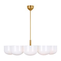 a brass chandelier with five white glass shades