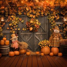 two scarecrows and pumpkins in front of a barn door decorated for halloween