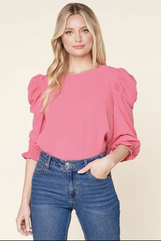 Elevate your everyday style in the Go-Getter Celine Puff Sleeve Top. This top features a round neckline with three-quarter shirred puff sleeves with a smocked cuff. It has a standard fit and can easily be paired with any bottoms of your choice. Add dainty jewelry and loafers for a sophisticated look. - Shirred puff sleeve - Exposed back zipper - Smocked cuffs - Standard fit • Self: 100% Polyester • Care Instructions: Hand wash Pointelle Sweater, Go Getter, Wardrobe Style, Puff Sleeve Top, Dainty Jewelry, Everyday Style, Puff Sleeves, Three Quarter, Streetwear Fashion