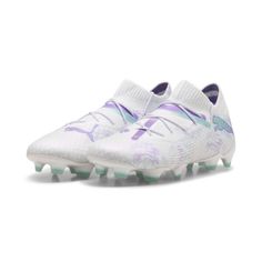 the white and purple nike vapor soccer shoe with spikes on the soles is shown