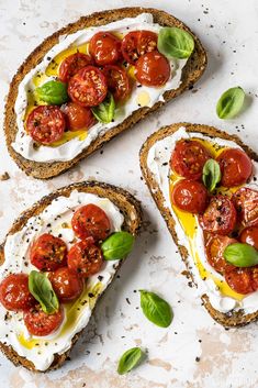 three slices of bread topped with tomatoes and cheese