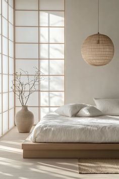 Tranquil Japandi bedroom with soft earth tones, crisp white linens, and a personalized DIY art piece