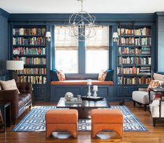 a living room filled with furniture and bookshelves