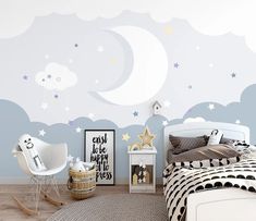 a child's bedroom with stars and clouds painted on the wall