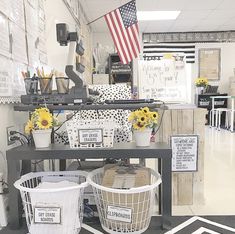 an office with sunflowers in baskets on the desk and other items sitting around